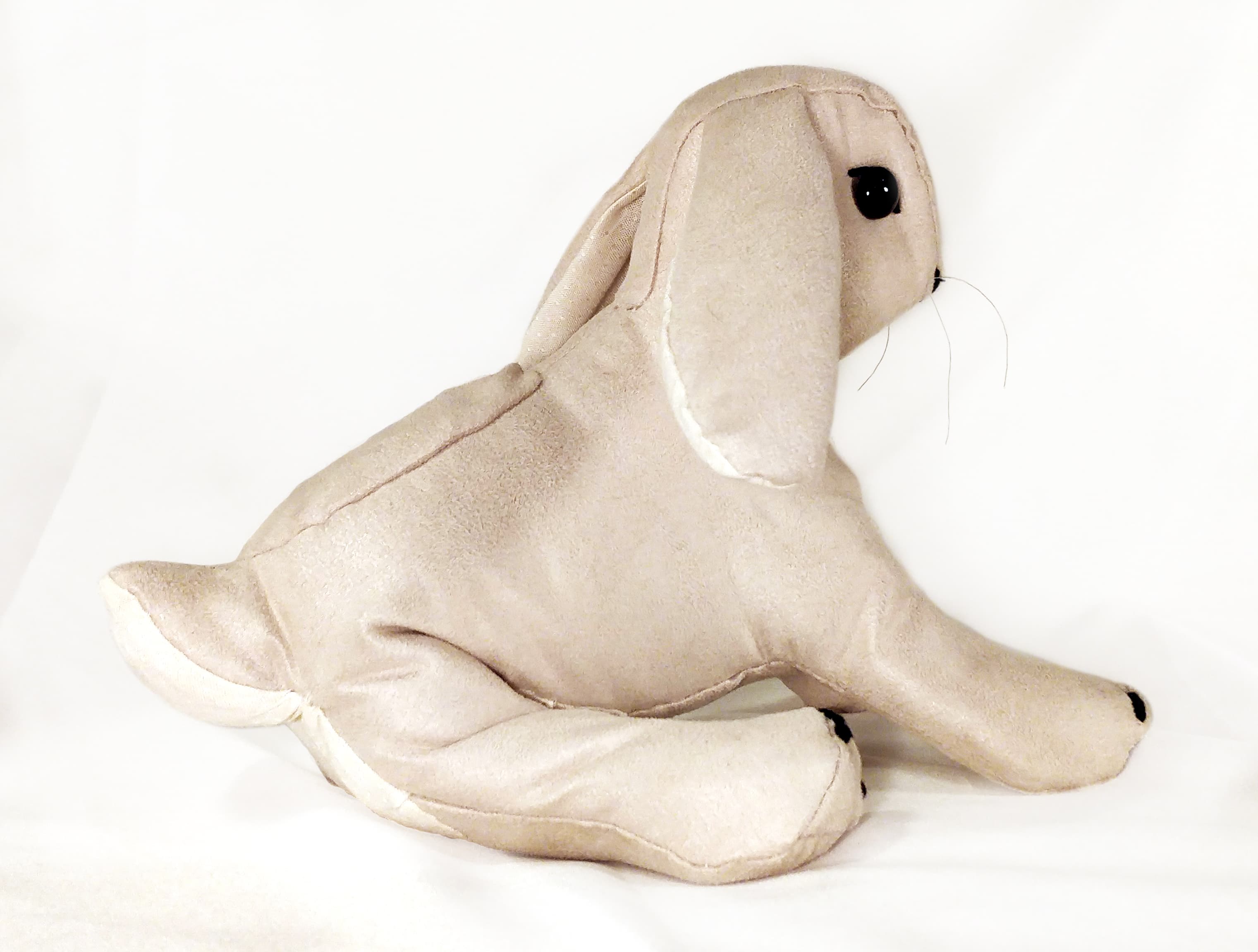 Thumbnail image: A stuffed toy rabbit, posed sitting