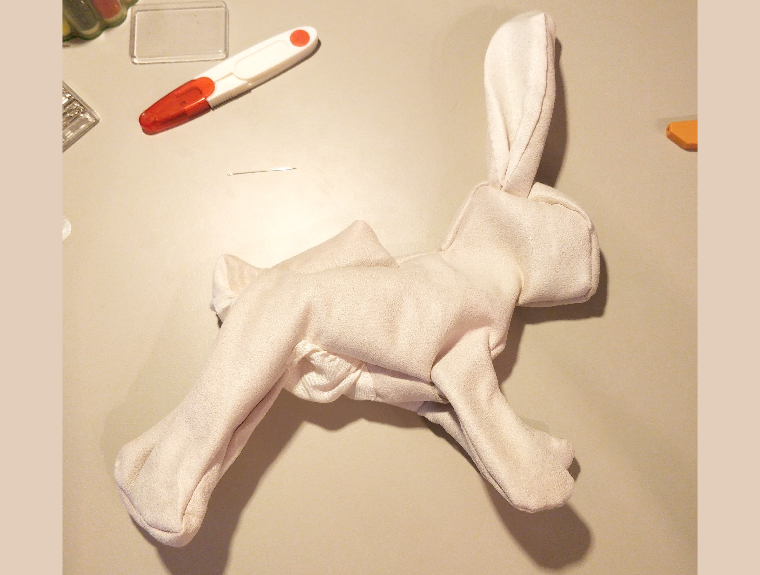 The unstuffed rabbit flipped and ready to be stuffed. There is a seam left unsewn on the back to fit the stuffing in.
