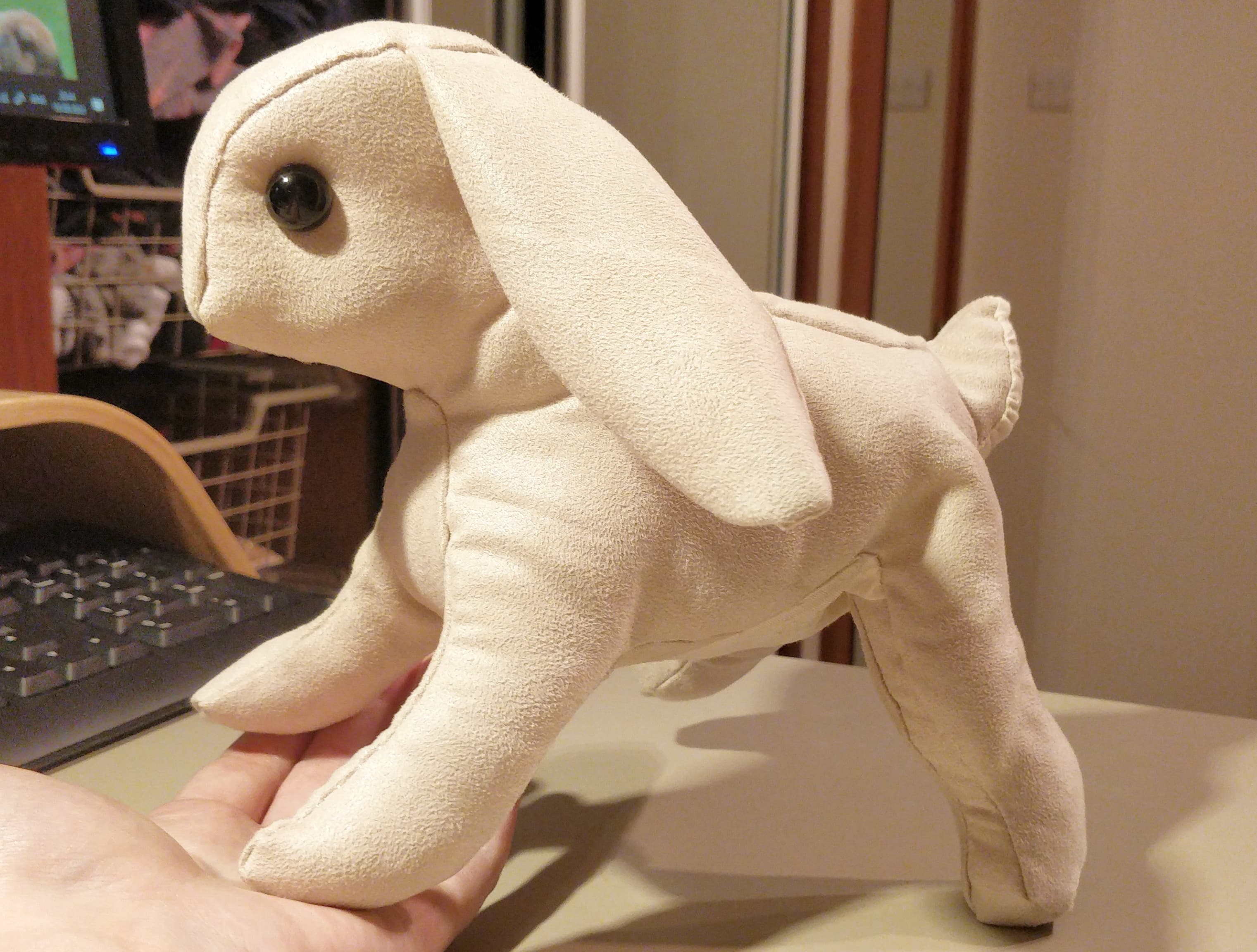 The stuffed rabbit before the black wool details were added.