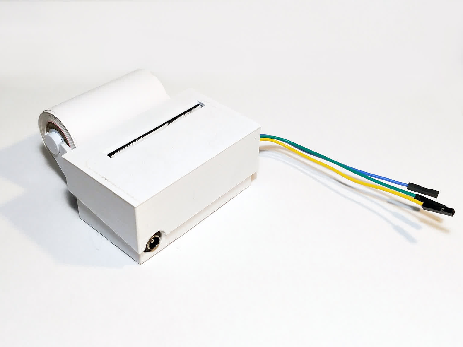 Thumbnail image: A small, white thermal printer, with a 3D printed housing