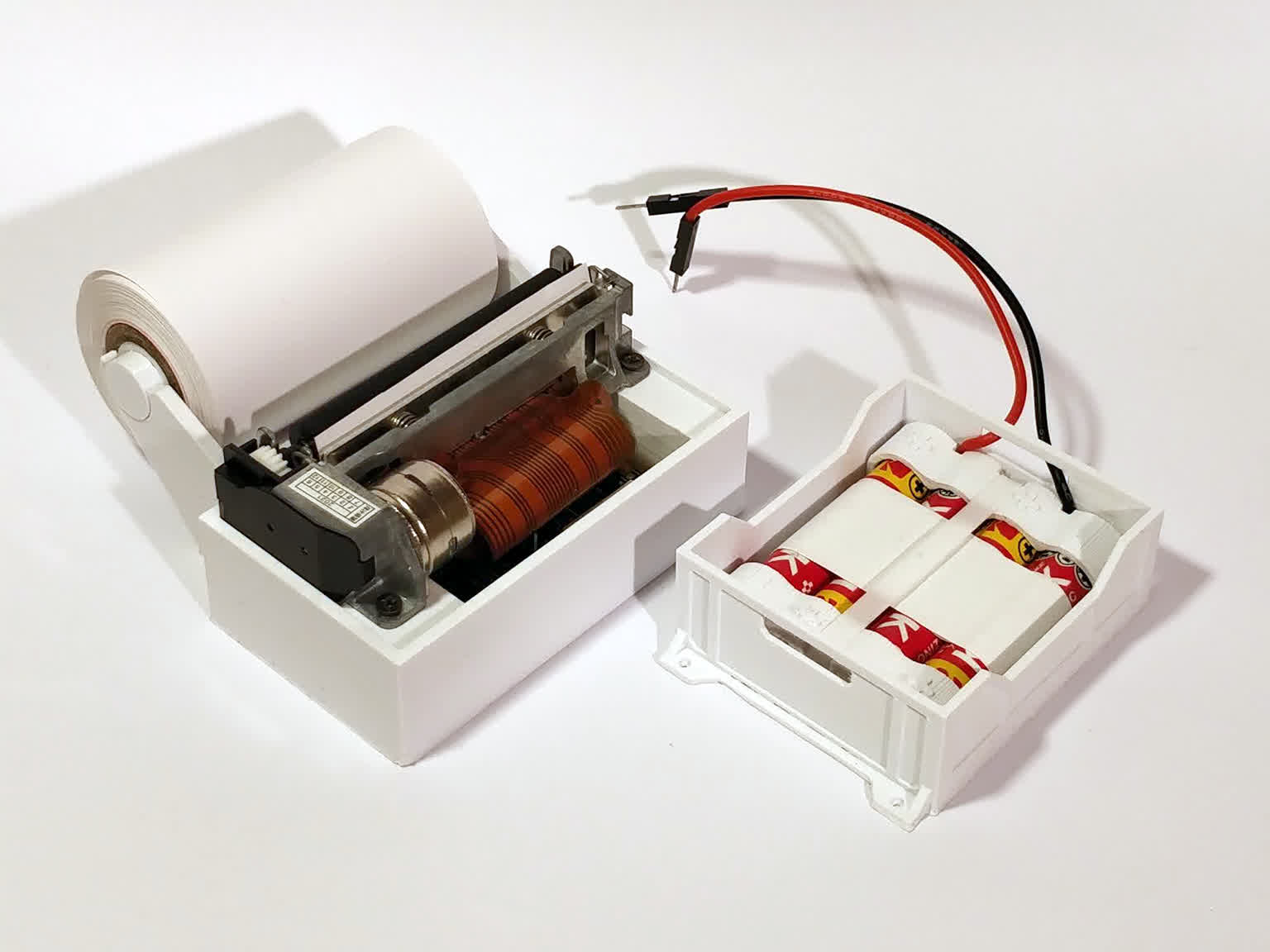 development thermal printer next to a battery pack I was using to power the arduino