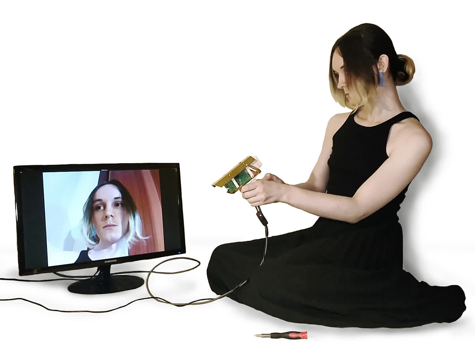 Thumbnail image: Mind's Eye camera, a figure looking at the camera's output on a monitor while it films